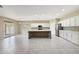 Spacious kitchen with white cabinets, a gray island and stainless steel appliances at 30308 W Whitton Ave, Buckeye, AZ 85396