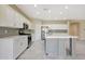 Modern kitchen featuring white cabinets, stainless steel appliances, and a center island at 30308 W Whitton Ave, Buckeye, AZ 85396