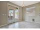 Bright living room with french doors overlooking the backyard at 30308 W Whitton Ave, Buckeye, AZ 85396
