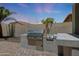 Outdoor kitchen featuring a built-in grill, countertop space, and easy access for alfresco dining and entertainment at 30308 W Whitton Ave, Buckeye, AZ 85396
