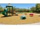 Community playground with a slide, swings, and various climbing structures for children to enjoy at 30308 W Whitton Ave, Buckeye, AZ 85396