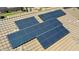 Aerial view of a home's roof featuring an array of newly installed, energy-efficient solar panels at 30308 W Whitton Ave, Buckeye, AZ 85396
