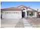 Charming single-story home with a red tile roof, well-manicured landscaping, and two-car garage at 3224 E Desert Cove Ave, Phoenix, AZ 85028