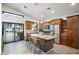 Modern kitchen features granite countertops, stainless steel appliances, a center island, and backyard access at 3224 E Desert Cove Ave, Phoenix, AZ 85028