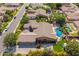 Aerial view of a luxury home showcasing pool, landscaping, and a backyard playset at 3460 E Lynx Pl, Chandler, AZ 85249