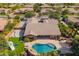 Aerial view of a home featuring pool, backyard basketball court, and outdoor entertainment at 3460 E Lynx Pl, Chandler, AZ 85249