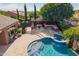 Aerial of backyard with a luxurious pool, spa, cabana, and outdoor seating area at 3460 E Lynx Pl, Chandler, AZ 85249