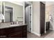 Bathroom with granite countertop, dark wood cabinetry and multiple doorways at 3460 E Lynx Pl, Chandler, AZ 85249