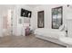 Bedroom boasts tile floors, a bed, a desk, and a TV, providing a functional and stylish space at 3460 E Lynx Pl, Chandler, AZ 85249