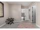 Neutral bedroom with gray carpet and view to bathroom and closet at 3460 E Lynx Pl, Chandler, AZ 85249