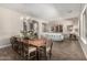Open dining space with hardwood floors, chandelier lighting, and ample seating at 3460 E Lynx Pl, Chandler, AZ 85249