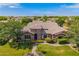 Stunning home showcases stone accents, lush landscaping, and a well-manicured lawn at 3460 E Lynx Pl, Chandler, AZ 85249
