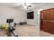 Home gym with fitness equipment, a far-infrared sauna, and wood-look floors at 3460 E Lynx Pl, Chandler, AZ 85249