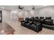 Home theater boasts large reclining seats, a projector screen, and nearby staircase at 3460 E Lynx Pl, Chandler, AZ 85249