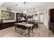 Modern kitchen with dark cabinetry, stainless steel appliances, and spacious island at 3460 E Lynx Pl, Chandler, AZ 85249