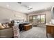 Spacious primary bedroom features neutral tones, a sitting area, and plantation shutters at 3460 E Lynx Pl, Chandler, AZ 85249