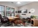 Home office boasting abundant natural light, modern decor, and comfortable seating at 3460 E Lynx Pl, Chandler, AZ 85249