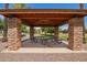 Community pavilion features picnic tables and stone pillars, perfect for outdoor gatherings at 3460 E Lynx Pl, Chandler, AZ 85249