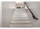 Staircase features decorative tiles on each step, wood-look floors, and a wood handrail at 3460 E Lynx Pl, Chandler, AZ 85249