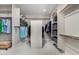 Walk-in closet with custom shelving, hanging rods, and ample storage space with a bench seat at 3460 E Lynx Pl, Chandler, AZ 85249