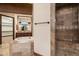 Bathroom featuring a soaking tub, walk-in shower with tile surround, granite counters, and a walk-in closet at 3523 E Presidio Cir, Mesa, AZ 85213