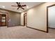 Bedroom featuring a ceiling fan, and access to an adjacent bathroom and walk-in closet at 3523 E Presidio Cir, Mesa, AZ 85213