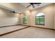 Spacious bedroom with large windows, ceiling fan and full wall mirror, perfect as dance studio or exercise room at 3523 E Presidio Cir, Mesa, AZ 85213