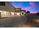 A long driveway leads to a spacious garage offering plenty of parking and storage space for vehicles at 3523 E Presidio Cir, Mesa, AZ 85213