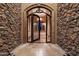 Grand entrance featuring stone walls, tile flooring and a wrought iron gate at 3523 E Presidio Cir, Mesa, AZ 85213