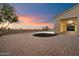 A long, paved driveway leads to a spacious garage and offers plenty of parking and exterior privacy at 3523 E Presidio Cir, Mesa, AZ 85213
