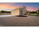 Spacious garage with ample parking, exterior lighting, and a lush lawn, providing convenience and curb appeal at 3523 E Presidio Cir, Mesa, AZ 85213