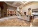Open living room with fireplace, spacious layout, and direct access to the kitchen at 3523 E Presidio Cir, Mesa, AZ 85213