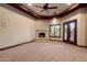 Cozy living room with a fireplace and natural lighting at 3523 E Presidio Cir, Mesa, AZ 85213