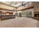 Open living room with direct access to the backyard, a fireplace, and tile flooring at 3523 E Presidio Cir, Mesa, AZ 85213