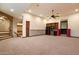 Spacious recreation room features an arched entryway, kitchenette, and access to a cinema room at 3523 E Presidio Cir, Mesa, AZ 85213