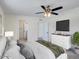 Bedroom includes ceiling fan, TV, ensuite bath, and ample natural light at 3650 E Laurel Ln, Phoenix, AZ 85028