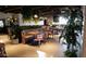 Dining room interior with dark wood booths, tables, and green plants at 3650 E Laurel Ln, Phoenix, AZ 85028