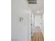 Hallway featuring wood-look floors and access to rooms at 3650 E Laurel Ln, Phoenix, AZ 85028