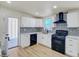Updated kitchen with white cabinets, modern backsplash, and stainless steel appliances at 3650 E Laurel Ln, Phoenix, AZ 85028