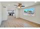 Open living room with access to the kitchen, with ample natural light at 3650 E Laurel Ln, Phoenix, AZ 85028