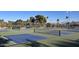 Close up view of pickleball courts, nets, and palm trees at 3650 E Laurel Ln, Phoenix, AZ 85028
