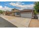 Well-maintained homes in a neighborhood with private garages and mature landscaping at 3756 E Kerry Ln, Phoenix, AZ 85050