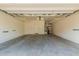 Spacious and clean garage with ample ceiling storage racks and utility shelf at 3756 E Kerry Ln, Phoenix, AZ 85050