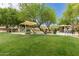 Community playground surrounded by lush greenery and picnic areas at 3756 E Kerry Ln, Phoenix, AZ 85050