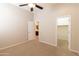Carpeted bedroom showcasing an ensuite bathroom and walk-in closet at 4241 E Andre Ave, Gilbert, AZ 85298