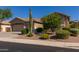 Lovely home showcasing desert landscaping, a low-maintenance yard, and a sprawling three-car garage at 4241 E Andre Ave, Gilbert, AZ 85298