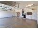 Garage featuring epoxy floors, storage cabinets, and ample space at 4241 E Andre Ave, Gilbert, AZ 85298