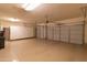 Spacious two car garage featuring epoxy floors and built in cabinets at 4241 E Andre Ave, Gilbert, AZ 85298