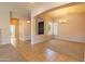 Bright living space with open design, large windows, tiled floors, carpet and stylish chandelier at 4241 E Andre Ave, Gilbert, AZ 85298