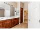 Spacious main bathroom with double sinks, storage cabinets and walk-in closet at 4241 E Andre Ave, Gilbert, AZ 85298